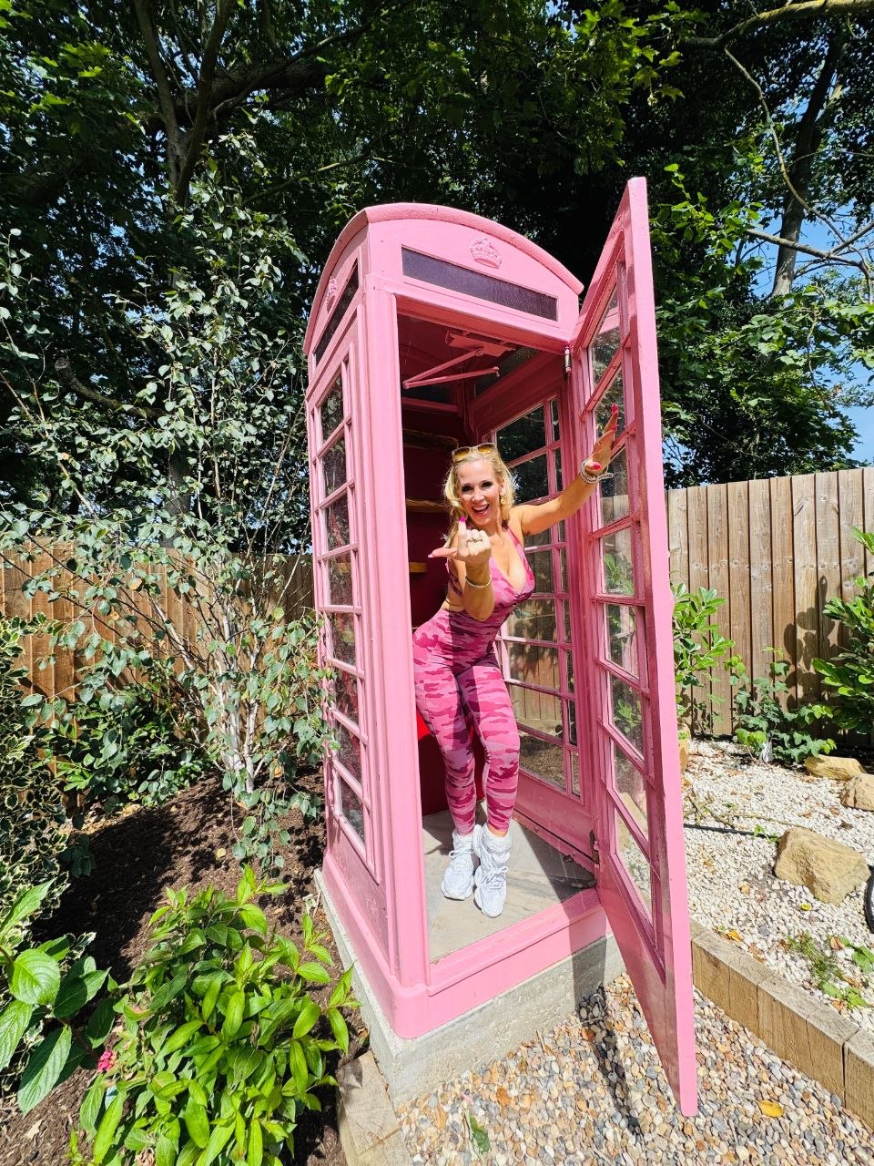 Rebecca inside the pink phone box